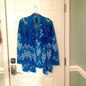 rafaella jacket small fits more like a medium. Blue,teal, black and white